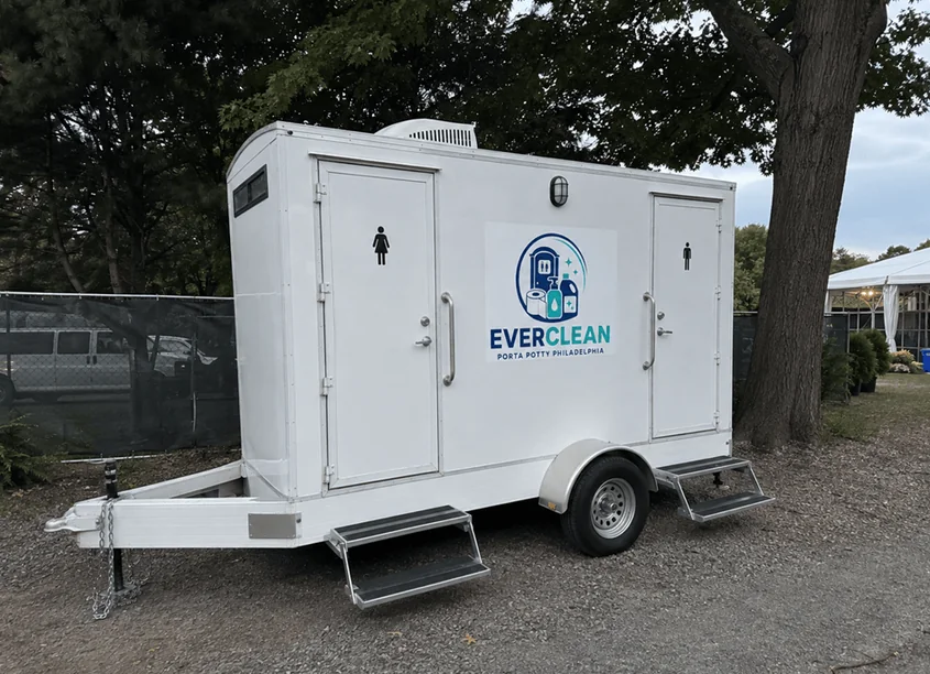 Side view of the Everclean Porta Potty Philadelphia restroom trailer with separate entry doors and steps